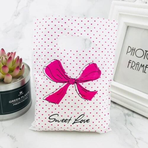 New Design 15x20cm Hot Pink Polka Dot Bow Jewelry Plastic Bag With Handles 100pcs Shopping Bag Packaging Wedding Decoration