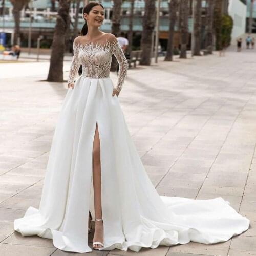 Sparkly Wedding Dress 2021 A-Line Sheer Neck Long Sleeve Side Slit Lace Appliques Sequins Beads Bridal Gown Vestidos De Noiva