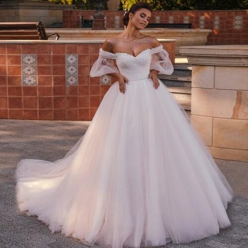 Gorgeous Off Shoulder Ball Gown Wedding Dresses 2021 Sexy Corset Short Sleeve Sweetheart Princess Beaded Bridal Wedding Gowns