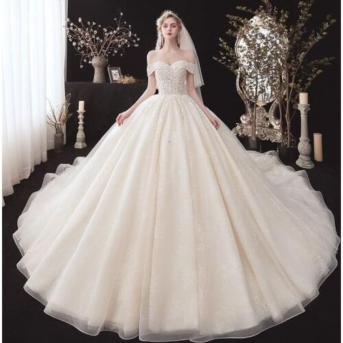Boat Neck Wedding Dress 2021 with Beads Lace Fabric Puffy Skirt Bride Gown Chapel Train Women Wedding Ball Gown New