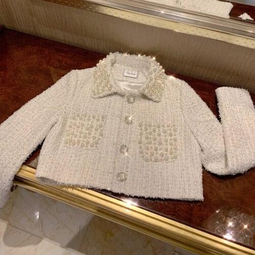 People New group of designed a short jacket with famous personality and custom made nailed beads for heavy industry