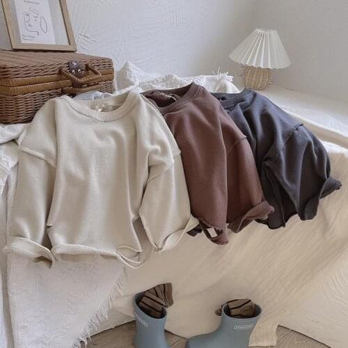 Korean childrens clothing solid color gas wei clothing INS literary children and girls cut holes loose-fitting bottom shirt top
