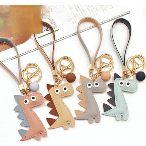 2021 New Hand Strap Dinosaur Key Chain Bag Pendant Car Mobile Phone Accessories Creative PU Leather Material KeyChain Key Ring