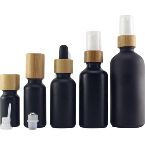 CBD oil spray lotion bottle 10ml 15ml 50ml 30ml Bamboo Cap Essential Oil Bottle Matte Black Frosted Glass Bamboo Dropper Bottle