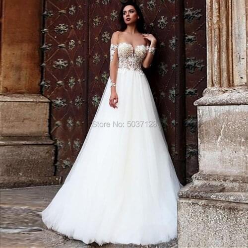2020 Long Sleeves A Line Tulle Wedding Dresses Off the Shoulder Vestido De Noiva Lace Appliques Backless Bridal Gown Court Train