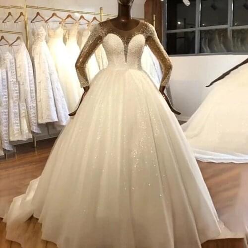 Sexy Sheer Long Sleeve Wedding Gowns with Pearls Beaded Tulle Ball Gown Wedding Dress Illusion Back Puffy Bridal Dress