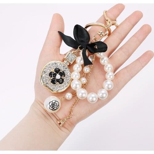 Black Enamel Camellia Keychain Women Men Jewelry Crystal Perfume Bottle Tassel Pearl Tower Key Ring Car Accessories Z121