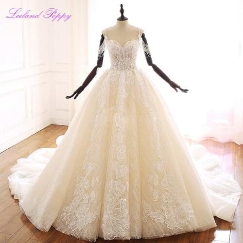 Lceland Poppy Lace Appliques A-Line Wedding Dresses 2020 Boat Neck Sleeveless Spaghetti Straps Beaded Bridal Gowns Chapel Train