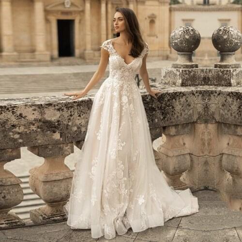 Bohemian Wedding Dresses Appliques Cap Sleeves V-Neck Lace Princess Bride Wedding Gown Sheer Back Bridal Dress vestidos Boho