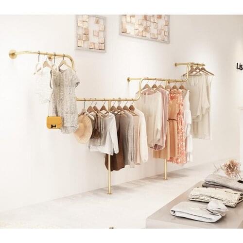 A shelf on which clothes are sold in a womens clothing store