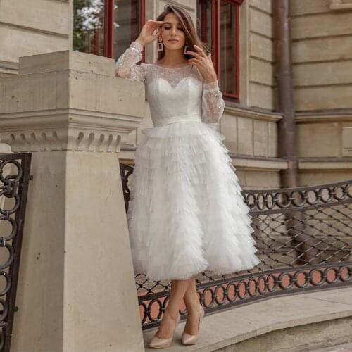 A Line Tea-length Wedding Dresses Sheer Scoop neck Long Sleeves Sequin Tulle Short Bridal Dress Ruffle Skirt Bridal Gowns