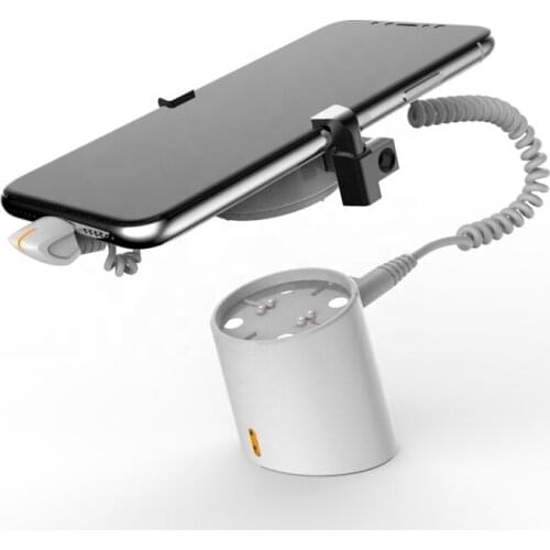 Magnetic smartphone secure display holder with charger function