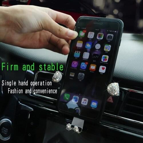 Vehicle mobile phone bracket diamond-encrusted automobile air outlet multifunctional bracket navigation bracket gravity buckle