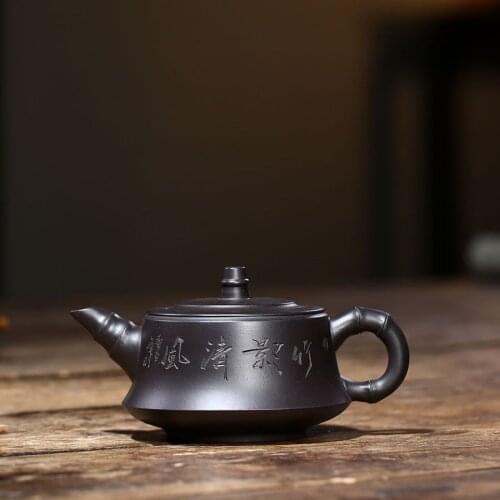 Newly listed marked tea pot 7 infuser holes handmade carved Chinese character real yixing zisha black zhu clay pot of tea China