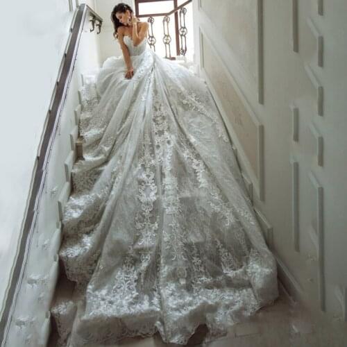 Cheap White Ball Gown Wedding Dresses with See Through Sleeve Lace Up Appliques Bead Ruffles Hem Bridal Dress