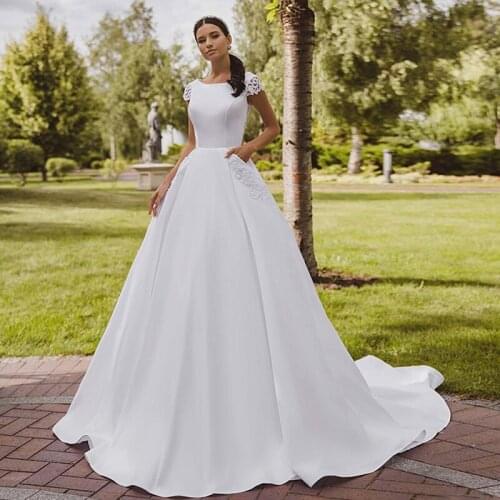 Amazing Satin Bateau Neckline A-line Wedding Dresses With Lace Appliques 3D Short Sleeves Illusion Back Bridal Gowns 2021