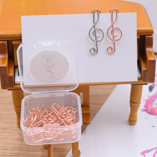 Electroplated metal musical note paper clip treble clef pin treble note music symbol trumpet close needle bookmark student