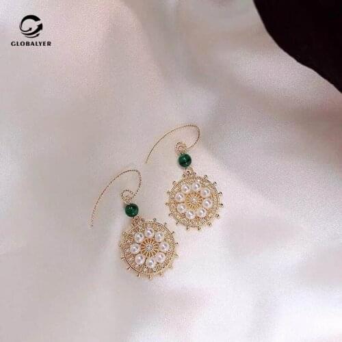 Lucky disc micro inlay craft earrings Female French pearl earrings Simple wild Korean earrings retro earrings 606