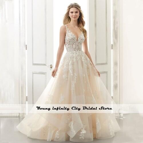 Romantic V Neck Open Backless Ruffle Wedding Dress Lace Appliques A Line Champagne Bride Dress 2020 Fit-and-Flare Wedding Dress
