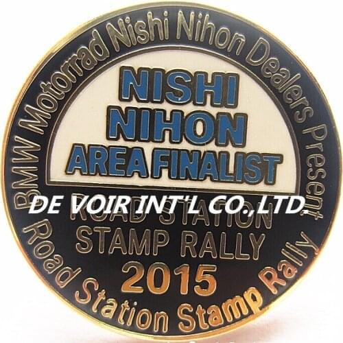 Round metal enamel pins with gold plating and blue enamel