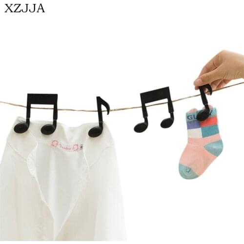 XZJJA Creative 2pcs cartoon clip strong plastic clothes-pin shape Receive a clip Socks Hanging Pegs Clamps Laundry Photo holder