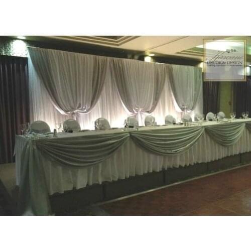 Pure White Wedding Backdrop with gray swags