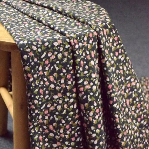 High quality corduroy fabric Small pink flowers on black background Print tissu Autumn winter dress pants cheongsam tissus