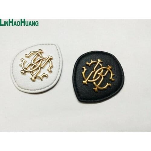 20pcs/lot black/white PU leather sew on Fashion labels with metal logo clothing label for jeans/jacket