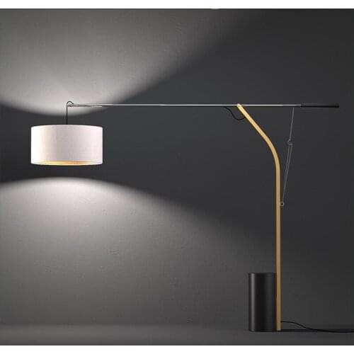 Postmodern sales department model room living room sofa next to fabric lampshade led floor lamp