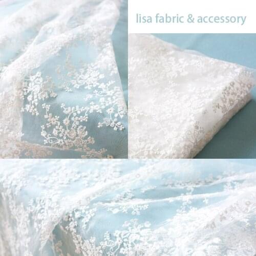 Import embroidery hollow out of bud silk fabrics Knitted fabric flower dress lace this white dress clothing