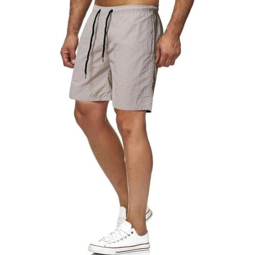 Swimming Shorts Solid Color Drawstring Men Quick Dry Pockets Elastic Waist Beach Shorts Beachwear Casual Leisure Short Pants