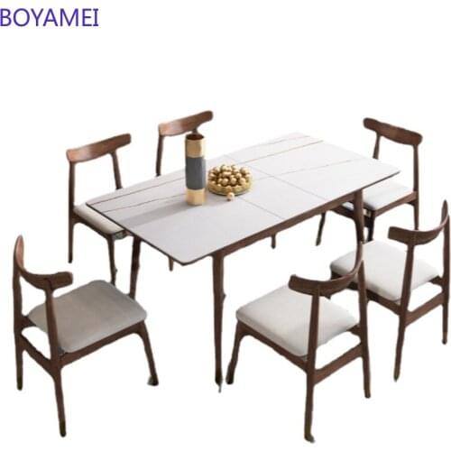 Nordic retractable rock plate dining table modern simple light luxury solid wood dining table chair combination rectangular