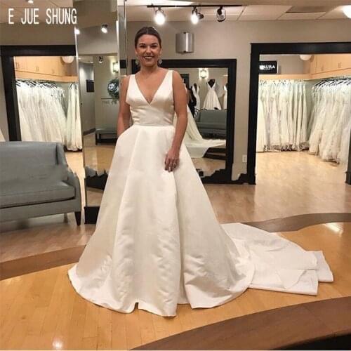 E JUE SHUNG Latest Satin Wedding Dresses Deep V Neck Open Back With Pockets Big Bow Wedding Gowns Sleeveless robe de mariee