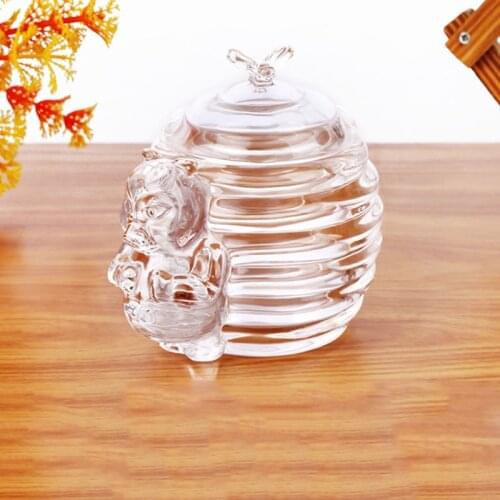 A 300ml Honey bear jar with a stick. Musa Collection and Storage Project