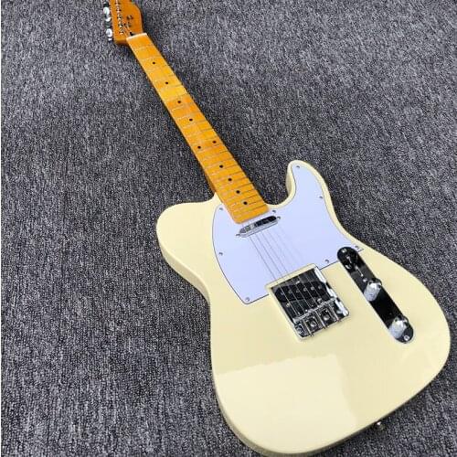 Factory direct sales of 6-string electric guitar, milky white paint, white panel, retro neck, back wearing strings