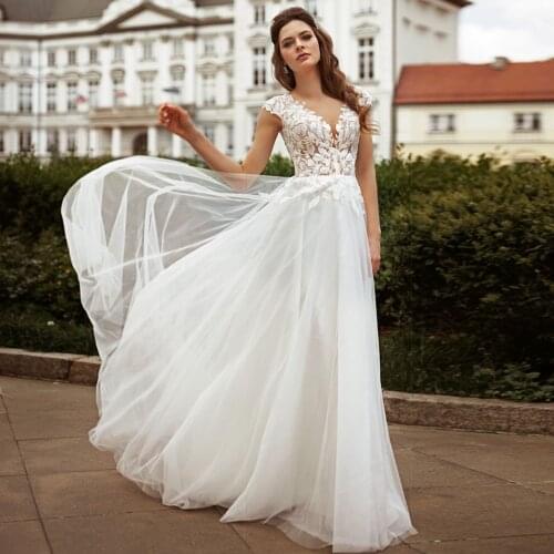 Illusion V Neck Sleeveless Wedding Dresses A Line Cap Sleeve Appliques Floor Length Bohemian Boho Bride Dresses 2021