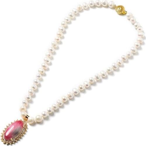 The 8-9 mm tiny Creamy pearls are matched by A light red Natural Pearl Necklace with a Light Grey Oval 24*39*10 mm pendant