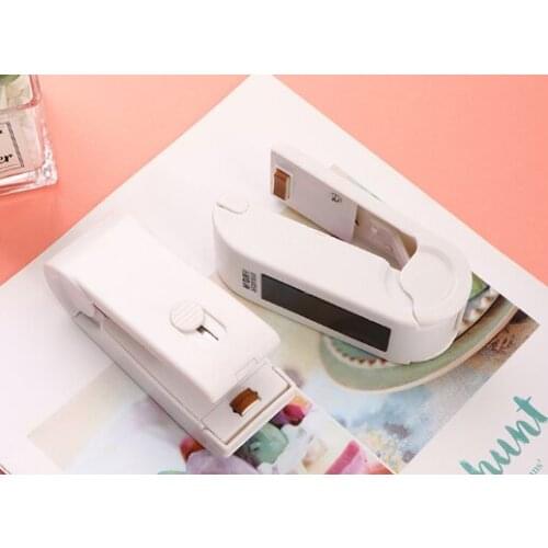 Small household hand pressure snack vacuum food packaging heat sealing machine J03