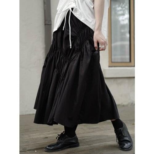 Japanese original home-made Yamamoto style dark ultra-wide version of womens medium-length skirt with irregular pleats