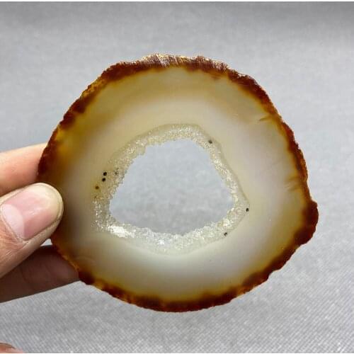 Natural agate slice polished ore specimen with crystal hole