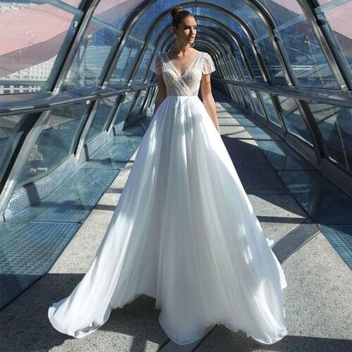 Charming Sheer V-Neck Wedding Dress 2021 A-Line Cap Sleeve Sequined Beading Sweep Train Bridal Gown For Women Chiffon Backless