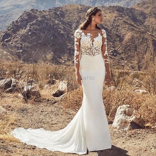 Mermaid Wedding Dresses with Lace Appliques Long Sleeves Backless Bridal Gowns Nude Tulle Scoop Neckline Vestido de Noiva 2020