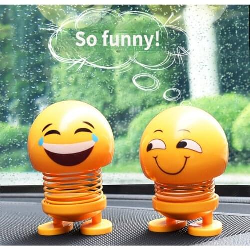 Lovely little yellow Ornaments doll funny baby shaking head Car Accessories Interior Decoration child doll telescopic Smell toy