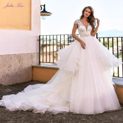 Julia Kui Gorgeous Cap Sleeve Of A Line Wedding Dress Backless Deep V Neckline With Puffy Tiered Skirt