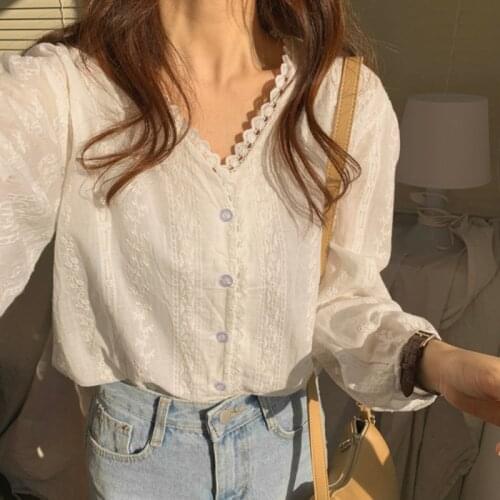 Korean style temperamen t top embroidery V-neck lace stitching white shirt female spring and autumn niche design sense top 2021