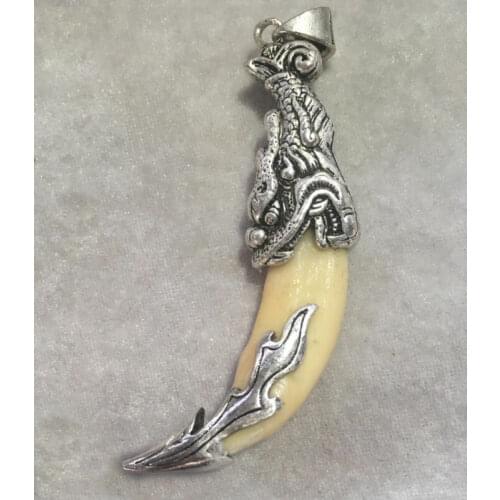 Wolfs teeth pendant set with Tibetan silver charms pendant