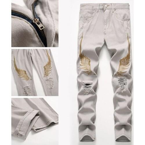 Regular fit denim jeans hole ruined small-foot fashion pants jeans men new Wings embroidered trousers large size