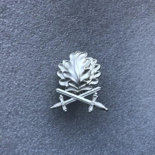 German silver double sword oak leaf Badge