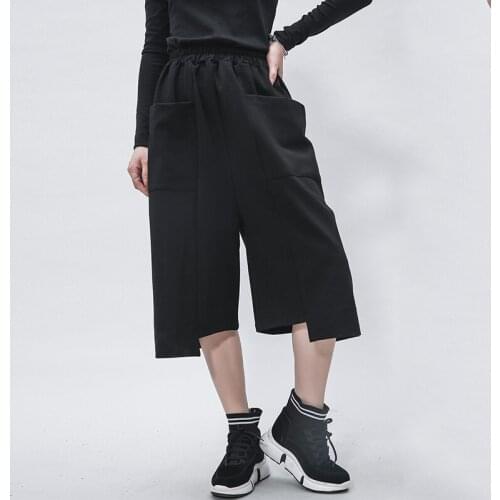 2021 spring and autumn new personalized stitching elastic waist tide brand wide leg pants Street irregular casual pocket Capris