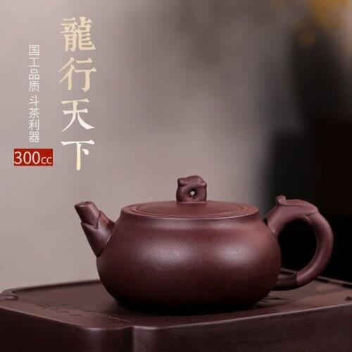 Clearance manufacturer of purple clay teapot dragon world sketch household teapot pure manual on a commission basis